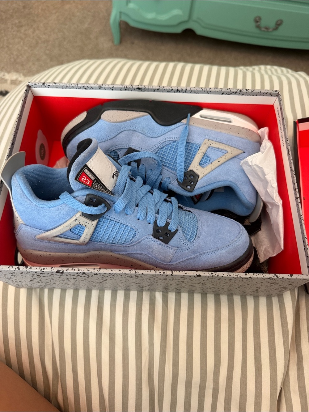 Air Jordan 4 Retro “University Blue” Sneakers